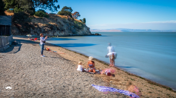 Bathers and visitors to China Camp State Park, San Rafael, CA. This was taken using a Neutral Density filter that helps reduce the amount of light captured by the camera's sensor. The shutter was open for 13 seconds. China Camp, San Rafael, CA, U.S.A. August 5, 2018
