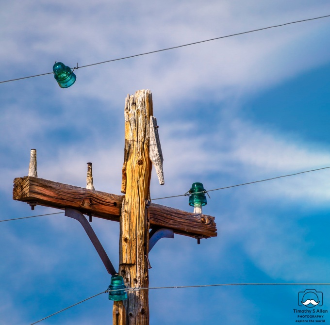 old wooden power pole and wires